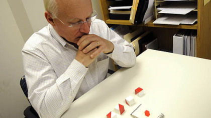 Alan Romatowski, who has early-onset Alzheimer's disease, attempts to arrange blocks into a pattern during a recent test at the University of Pittsburgh Alzheimer Disease Research Center at UPMC Montefiore in Pittsburgh.
